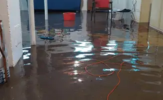 Basement with boiler, cabinets and washing machine completely flooded in Rochester, NY